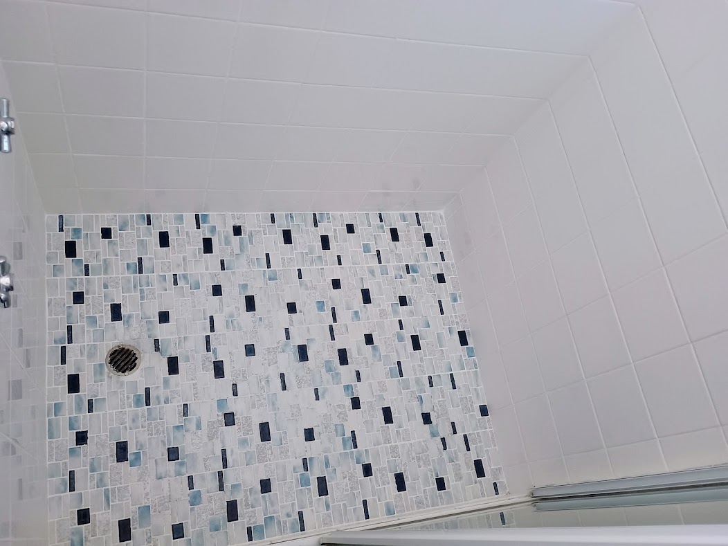 Clean finished shower with restored grout lines